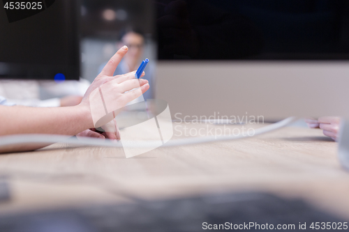 Image of businessman hand using pen