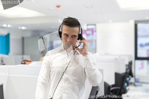 Image of male call centre operator doing his job