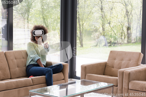 Image of black woman using VR headset glasses of virtual reality