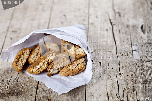 Image of Traditional Italian cookies cantuccini on white paper bag on ruc