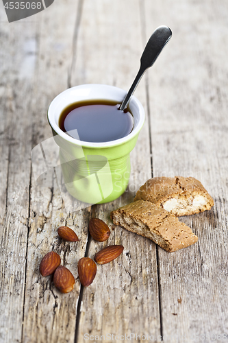 Image of Cup of coffee, fresh Italian cookies cantuccini and almond nuts 