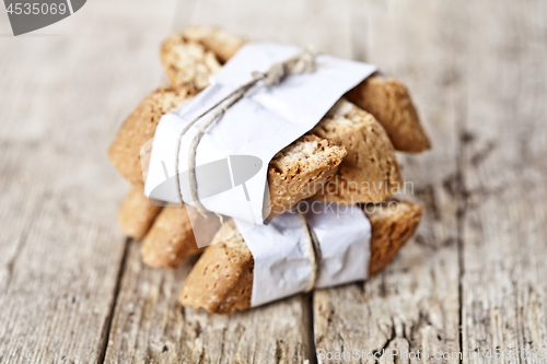 Image of Traditional Italian cookies cantuccini on white paper on ructic 