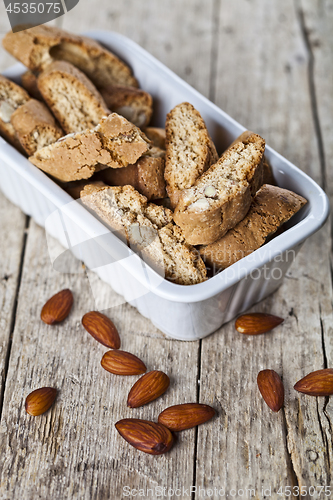 Image of Cookies cantuccini with almond seeds  in white ceramic bowl clos