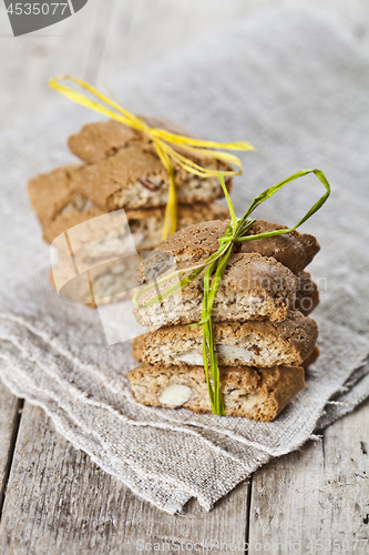 Image of Fresh Italian cookies cantuccini with almond seeds on linen napk