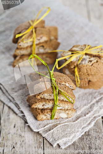 Image of Fresh Italian cookies cantuccini with almond seeds on linen napk