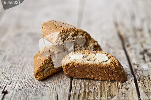 Image of Homemade Italian cookies cantuccini heap with almond seeds on ru