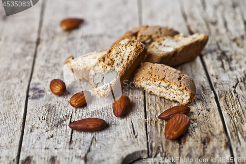 Image of Fresh homemade Italian cookies cantuccini heap and almond seeds 