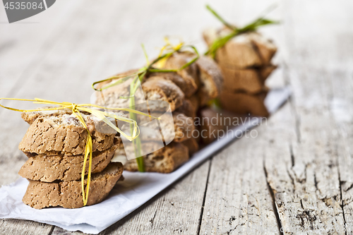 Image of Fresh Italian cookies cantuccini with almond seeds stacks on whi