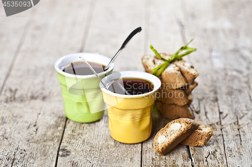 Image of Two cups of coffee and fresh Italian cookies cantuccini with alm