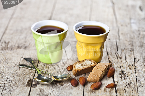 Image of Two cups of coffee, fresh Italian cookies cantuccini and almond 