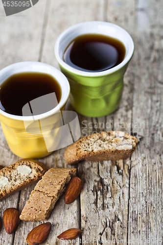 Image of Two cups of coffee, fresh Italian cookies cantuccini and almond 