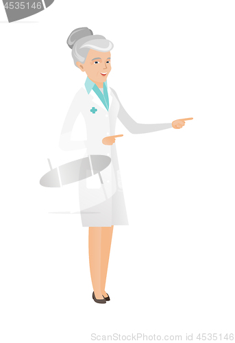 Image of Senior caucasian doctor pointing to the side