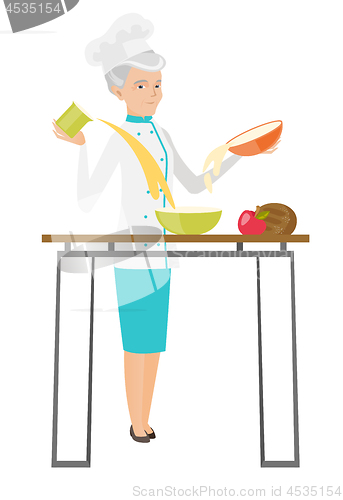 Image of Senior caucasian chef cook preparing food.