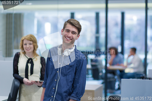 Image of Business People Working With Tablet in startup office