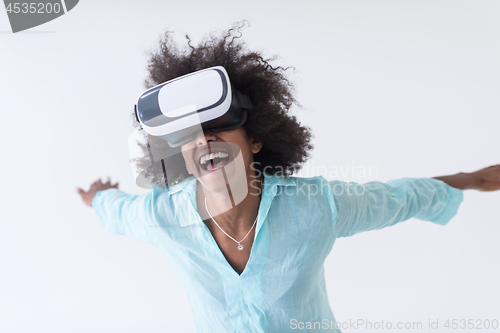 Image of black girl using VR headset glasses of virtual reality