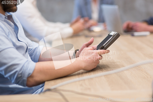 Image of businessman using tablet computer