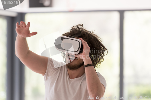 Image of man using VR-headset glasses of virtual reality