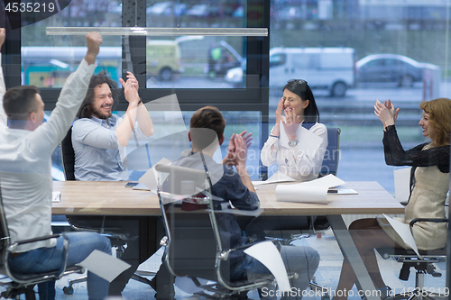 Image of startup Group of young business people celebrating success