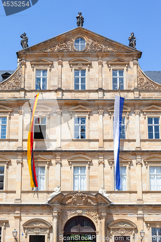 Image of historic building in Bamberg Germany with flags