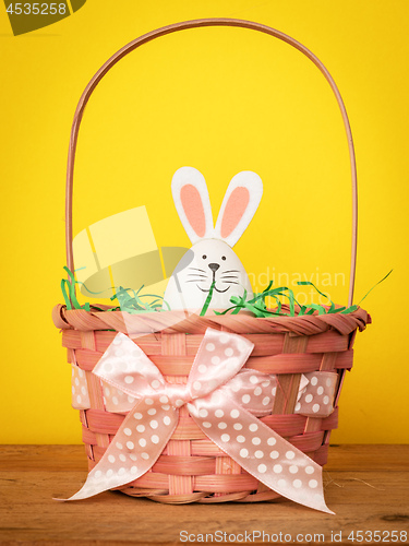 Image of sweet easter bunny figure in a basket