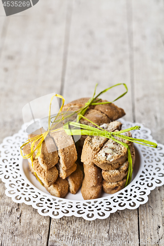 Image of Fresh Italian cookies cantuccini with almonds stacked on white p