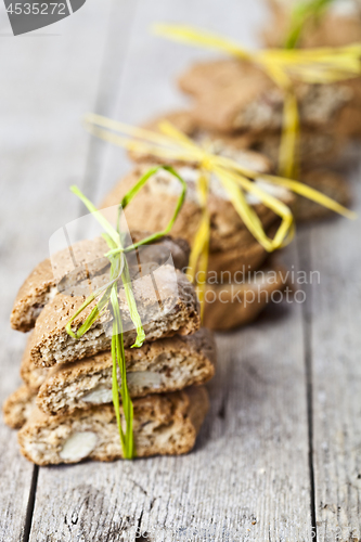 Image of Fresh homemade Italian cookies cantuccini with almond seeds on r