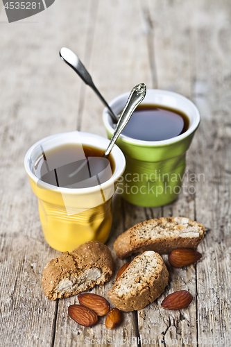 Image of Two cups of coffee, fresh Italian cookies cantuccini and almond 