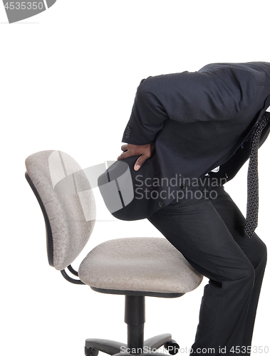 Image of Man with back pain getting up from chair