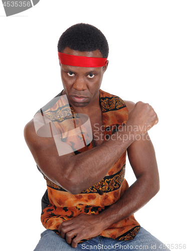 Image of Serious looking African man in a vest