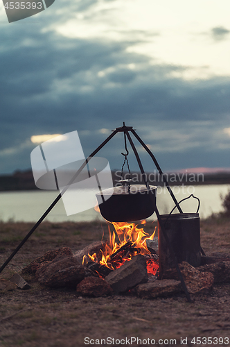 Image of Preparing food on campfire