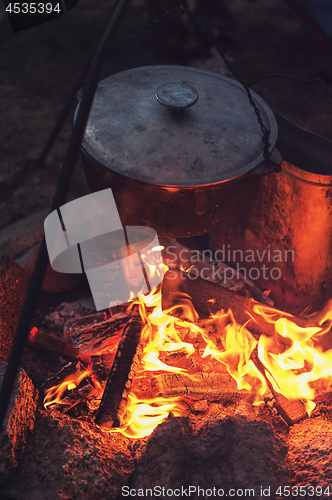 Image of guitar near the campfire