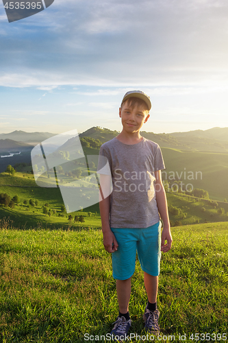 Image of Young explorer at the sunset