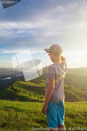 Image of Young explorer at the sunset