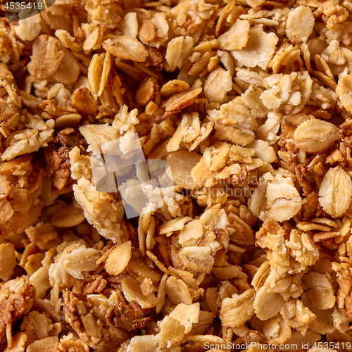 Image of Close-up of homemade natural Oat Granola breakfast cereal as background. Textura of oat flakes.