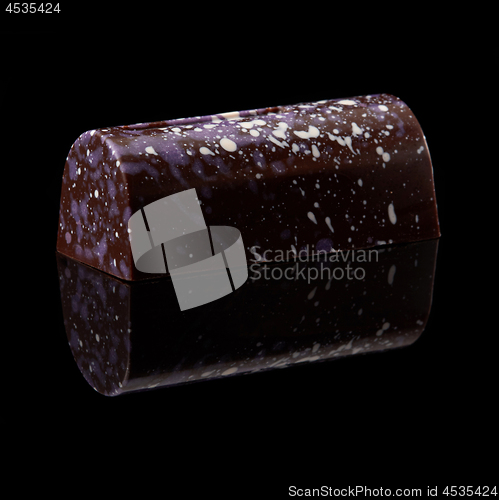 Image of chocolate candy on black background