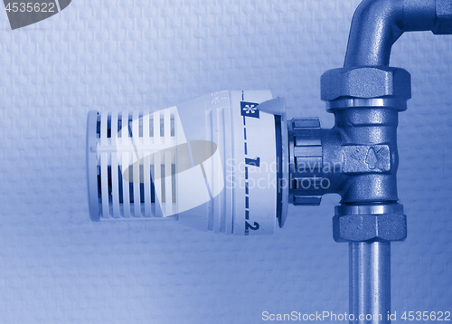 Image of Temperature knob of heating radiator, used and dusty