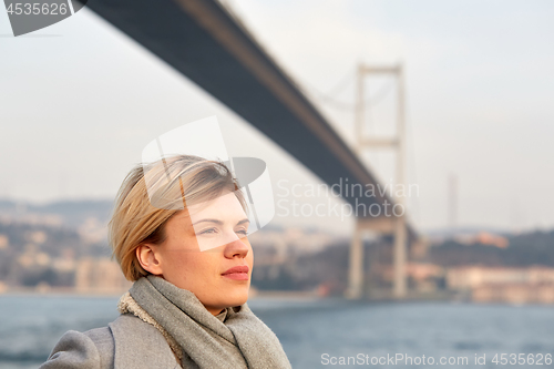 Image of Portrait of a young woman under the Bosporus bridge.