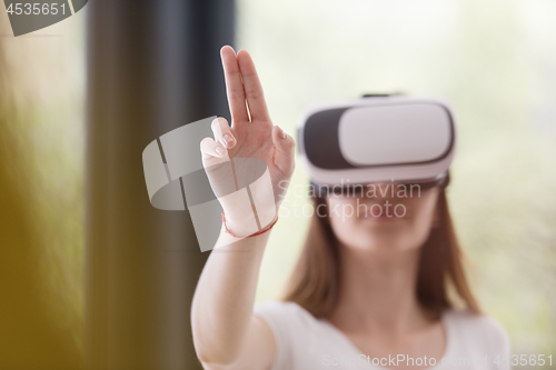 Image of woman using VR-headset glasses of virtual reality