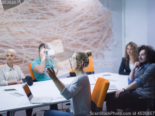 Image of startup business team using virtual reality headset