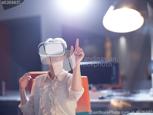 Image of businesswoman using VR-headset glasses of virtual reality