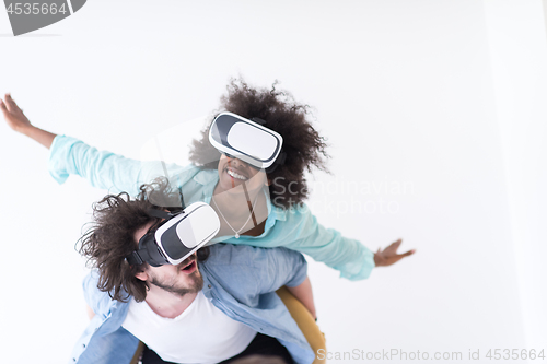 Image of multiethnic couple getting experience using VR headset glasses