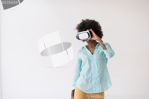 Image of black girl using VR headset glasses of virtual reality