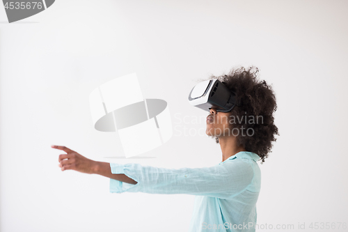 Image of black girl using VR headset glasses of virtual reality