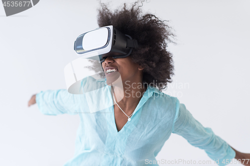 Image of black girl using VR headset glasses of virtual reality