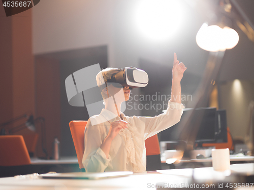 Image of businesswoman using VR-headset glasses of virtual reality