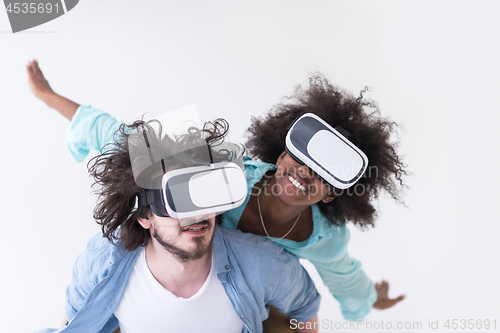 Image of multiethnic couple getting experience using VR headset glasses