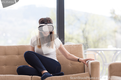 Image of woman using VR-headset glasses of virtual reality