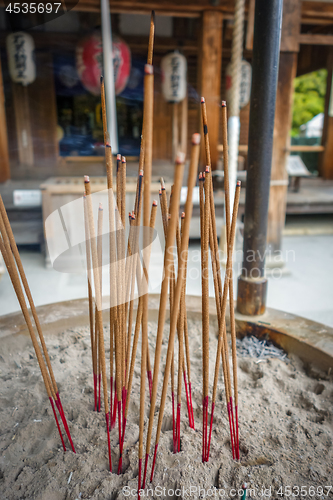 Image of incense sticks in Kinkaku-ji temple, Kyoto, Japan