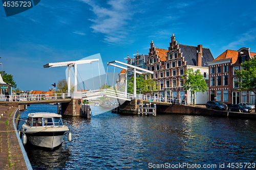 Image of Spaarne river with boat and Gravestenenbrug bridge in Haarlem, N