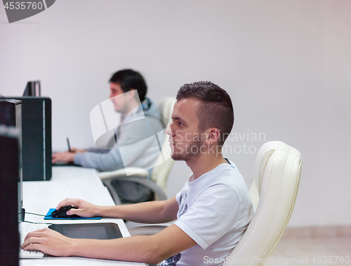 Image of Graphic Designer Working at Workplace